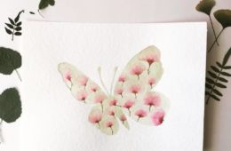 Mariposa en flor en acuarela